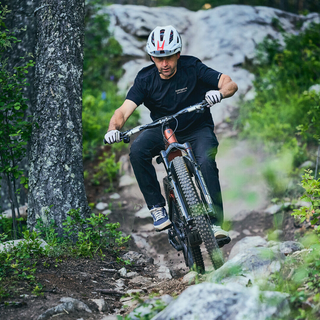 Man wearing 5Fifty helmet, riding on a trail